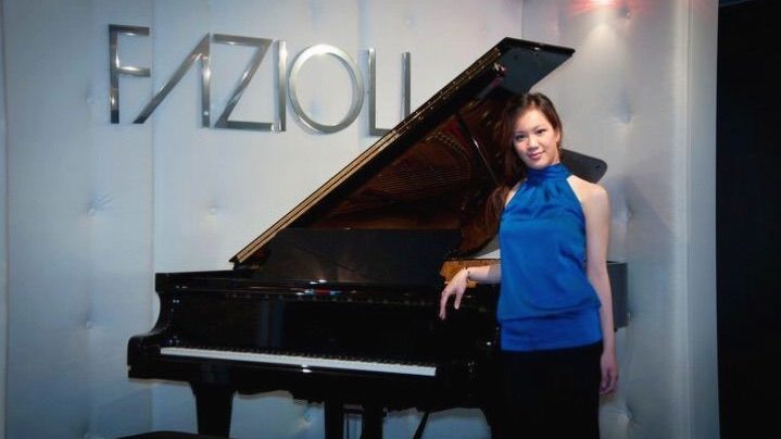BAH Piano Teacher Josie with a Luxurious Fazioli Grand Piano